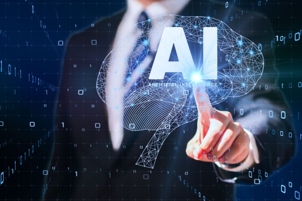 スーツ姿の男性がAI(人工知能)のホログラムに触れている未来的なイメージ